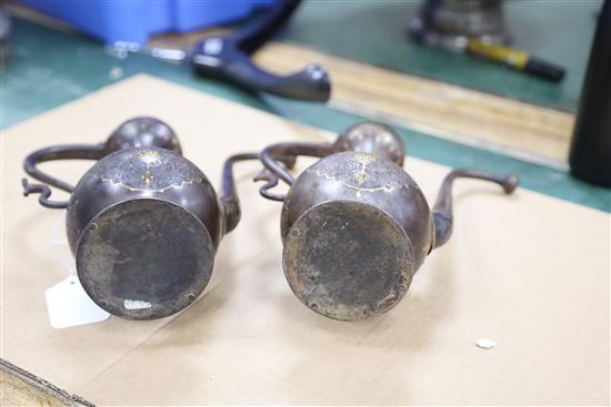 A pair of 19th century Qajar gold inlaid iron rosewater sprinklers, 12.5in.